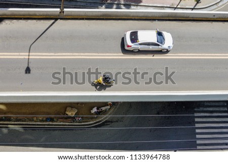 Photo of a top view of road with vehicles that can be used for mock ups, backgrounds, wedding, invitations cards and designs.