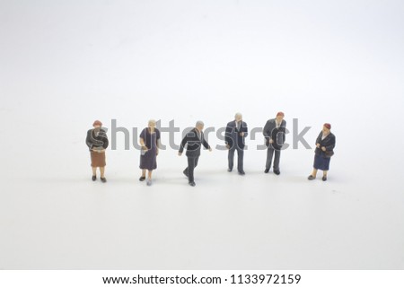 Mini people Shoppers buy goods on sale with discount


