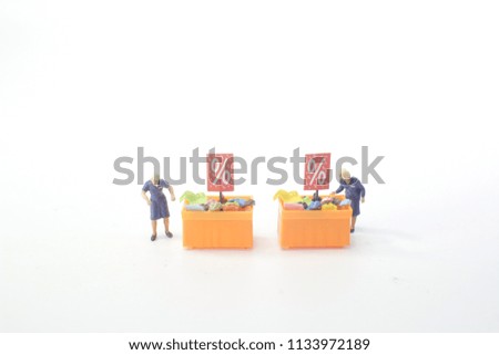 a Mini people Shoppers buy goods on sale 
