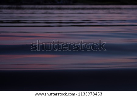 boat ripples at sunset