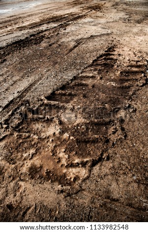 Tyre track on dirt sand or mud, Picture in retro or grunge tone. Car drive on sand. off road track.