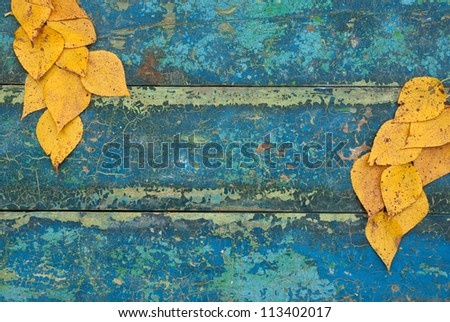 Autumn Leaves over wooden background