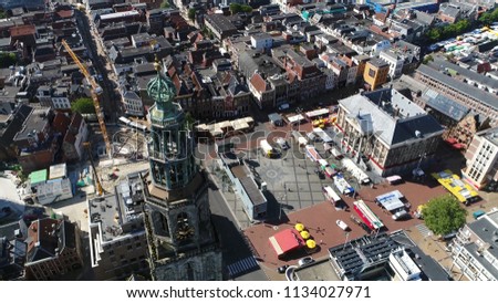 Aerial photo Grote Markt and Martinitoren highest church steeple in city of Groningen Netherlands and bell tower of Martinikerk located at north-eastern corner of Grote Markt Main Market Square