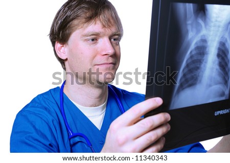 Male doctor looking at xray