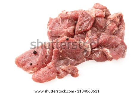 Raw fresh meat chunks isolated on white, ready for barbecue.