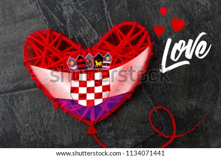 Flag of Croatia in the shape of heart on a dark background with the inscription Love. Copy space