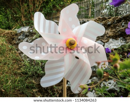 Pink and white garden windmill