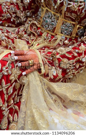 beautiful henna design on bride hand. Of Moroccan traditions in the wedding.
