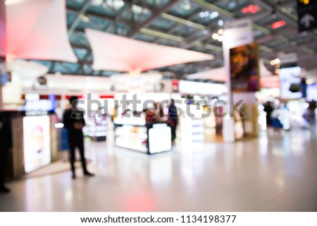 Abstract blurred of airport duty free shops for background using.