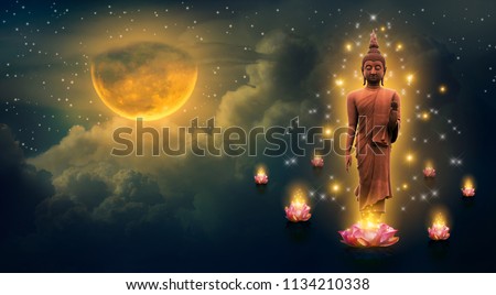 Buddha standing on a lotus in the sky at night The big moon is the background