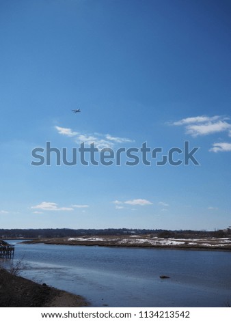 Airplane flying over a river