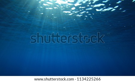 Abstract blue water background and sunburst 