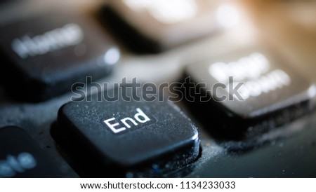 Close up photo of keyboard end button. Royalty high-quality free stock image of key end button on black keyboard with dust  