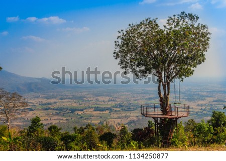 Tree of love in heart shaped with the green valley, blue sky and mountain range background. This public area is located at Ban Ruk Thai village, Noen Maprang district, Phitsanulok province, Thailand. Royalty-Free Stock Photo #1134250877