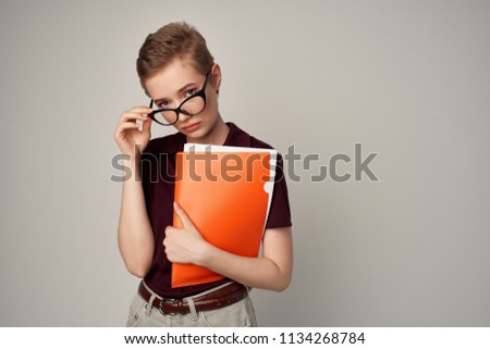    serious business woman in glasses with documents office                            