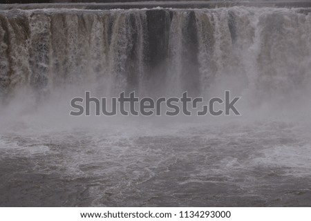 Muddy waterfall after heavy rain