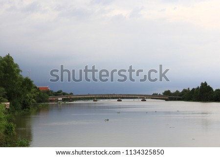 Bridge over Bangpakong river and white car