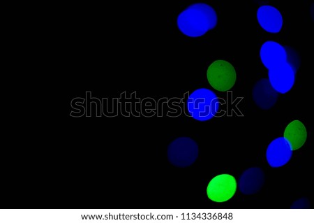 Lights blue and green color on black background. Abstract lights. bokeh effect.Abstract background. Defocus.