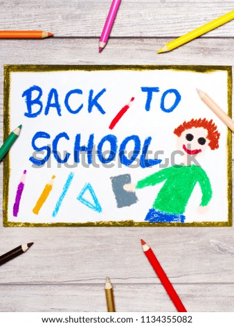Photo of colorful hand drawing. Smiling student and text: Back to school.