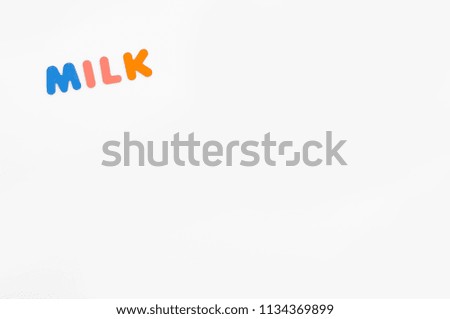 word milk made of colorful letters on white background