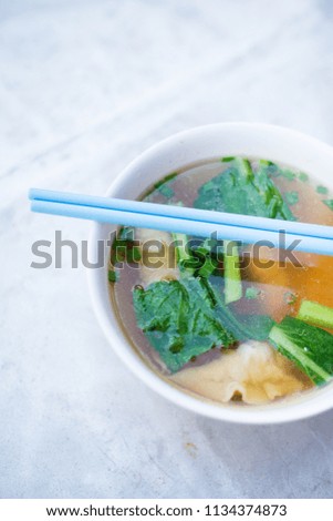 Fresh prepared malaysian spicy Sui Kau wonton soup served in local restaurant on Penang island. Traditional asian cuisine made of fresh ingredients.