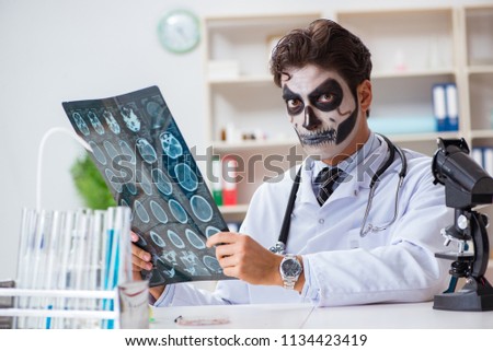 Scary monster doctor working in lab Royalty-Free Stock Photo #1134423419