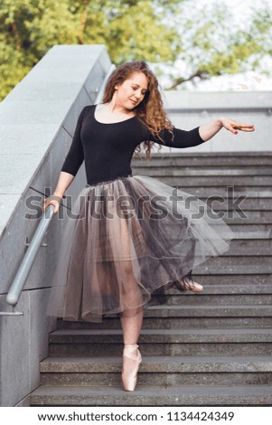 girl in pointes on the street. beautiful girl is dancing on the street. ballet on the street.