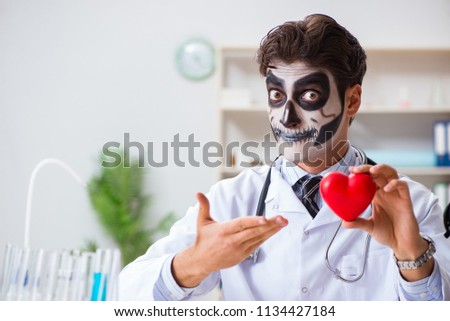 Scary monster doctor working in lab Royalty-Free Stock Photo #1134427184
