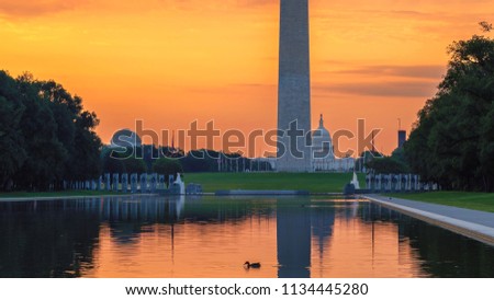 Washington Monument at Sunrise from new reflecting pool in Washington DC, USA.