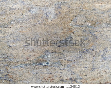 Stock macro photo of the texture of rough stone.  Useful for layer masks or abstract backgrounds.