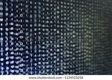 blocks of binary data. Blockchain concept. blue background with computer digital binary code bit number one and zero text. selective focus on the far end of the computer display out of focus in front.