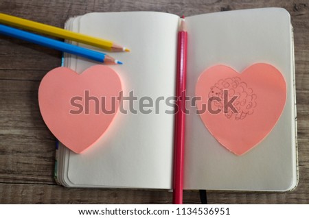 Sheep in sticky note on wooden table background