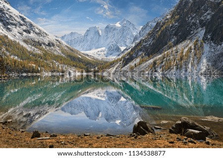 Snow covered winter mountain lake, Russia, Siberia, Altai mountains, Chuya ridge.