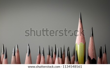One pencil standing out from the group of other pencil.Leadership and growth in business concept.
 Royalty-Free Stock Photo #1134548561