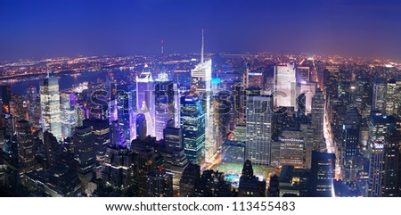 New York City Manhattan Times Square skyline aerial view panorama at night with skyscrapers and street.