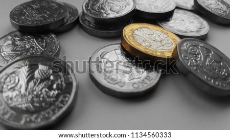 New British Pound Coins Spread Out. Isolated, Different, Standing Out, Vibrant, Unique. 