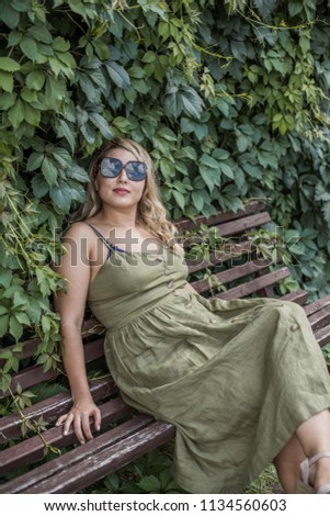 Plus size European or American sweet woman at nature, enjoy the life, walks. Life of people xl size, happy nice natural beauty woman. Concept of overweight