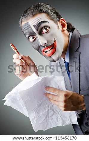 Businessman with clown face paint