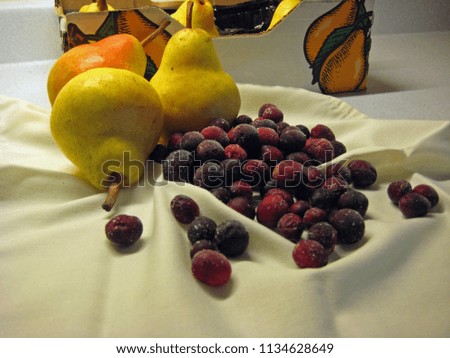 Pears and cranberries, ingredients for an autumn dessert