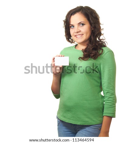 Attractive smiling girl in green shirt holding a poster of the right hand. Isolated on white background