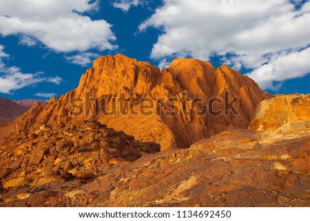 Amazing Sunrise at Sinai Mountain, Mount Moses with a Bedouin, Beautiful view from the mountain	 Royalty-Free Stock Photo #1134692450
