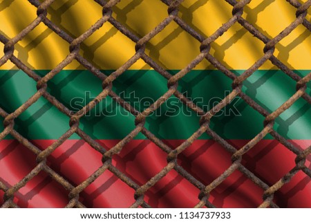 The ban on freedom of speech. The concept of the country's immigration policy regarding migrants, illegal immigrants and refugees. Steel grid on the background of the flag of Lithuania