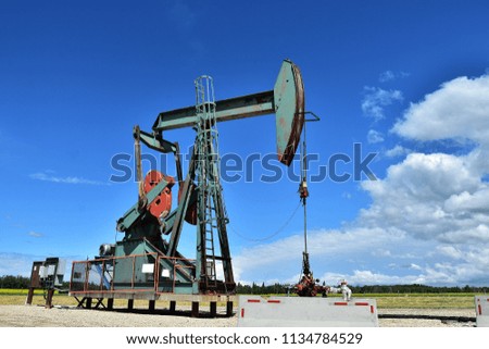 An image of an active oil and gas producing pump jack. 