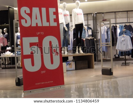 sales promotion of woman fashion clothes retail store in shopping mall. store front display for fashion background.
