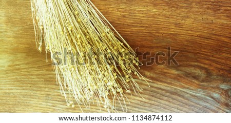 Dried bunch of herbs on a wooden background. Minimalistic screensaver.