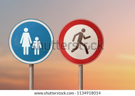 Problem in the family, divorce - man running away from a woman with a child. Road signs.