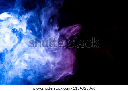 Colorful pink and blue  smoke  on a black isolated background. Background from the smoke of vape
