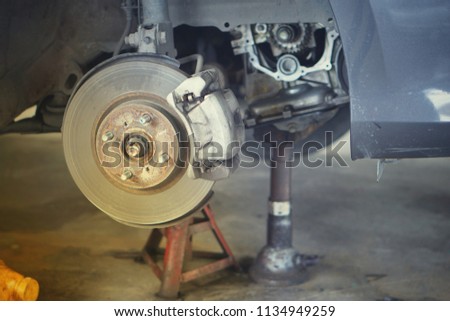 Car brake part at garage,car brake disc without wheels closeup.Close up.