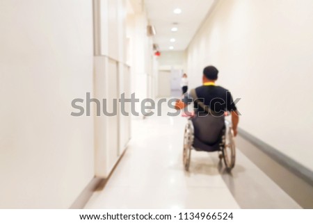 Blur images of the disabled in the mall. He is going to the toilet.