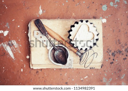 baking background with eggshell and cooking book